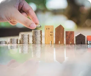 Estate Planning - miniature houses and coins being stacked